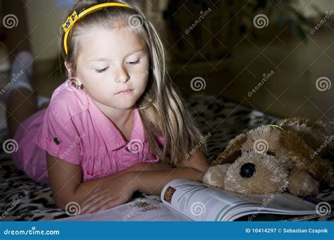 Girl Reading On Floor Stock Image 10414297