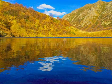 Beautiful Lake In Autumn Mountains With Blue Sky Reflection And Stock