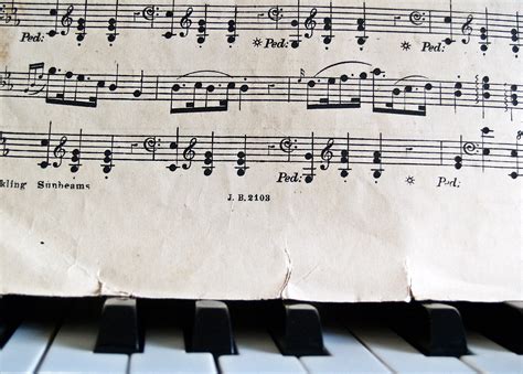 Music Notes And Sheet Music On A Piano Image Free Stock Photo