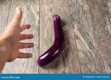 Hand Wants To Touch The Eggplant Stock Photo Image Of Touch Adult