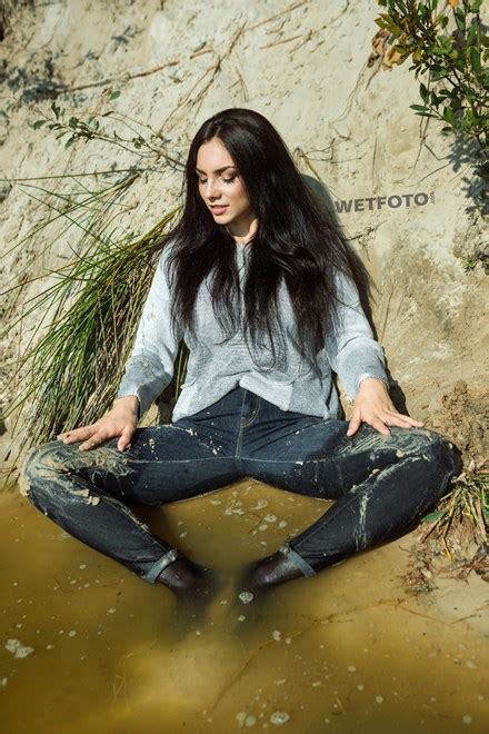Brunette Girl In Wet And Dirty Levis Jeans Has Fun By The Lake Wetfoto Com