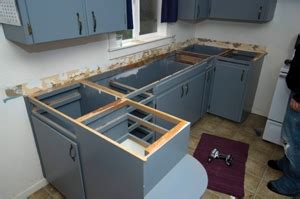 When moving them around, you will discover that upper cabinets are heavy—just imagine their weight when they're. Reconfiguring Kitchen Cabinets to Install a Dishwasher ...