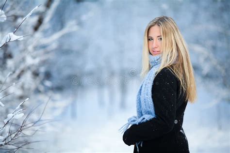 Winter Young Girl Walking Snowy Forest And Smiling At The Camera