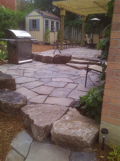 2 Tiered Random Flagstone Patio With Armour Stone Walls And Steps