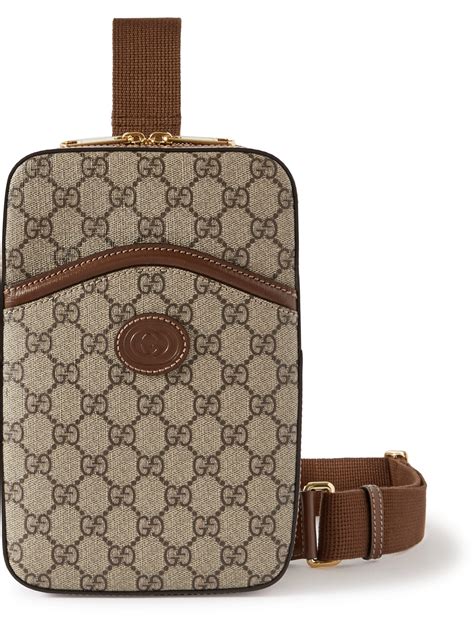Gucci Leather Trimmed Monogrammed Coated Canvas Messenger Bag In Beige