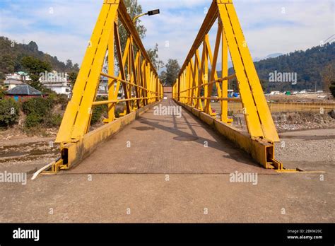 Yellow Steel Bridge Over River In Himachal Pradesh In Kangra Village