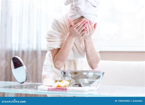 Beautiful Young Woman Washing Face With Water In The Morning Concept