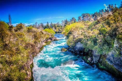 Blue River And Green Grass Under Blue Skies Rotorua Hd Wallpaper