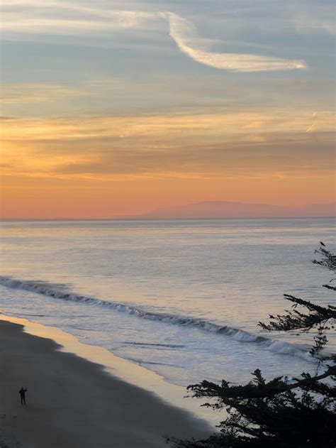 Ocean Waves Rushing To Shore During Sunset · Free Stock Photo