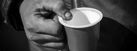 Meaning of pleading in english. Dirty Beggar Hand Holding Plastic Cup Poor Man Begging For Money On The Street Close Up Stock ...