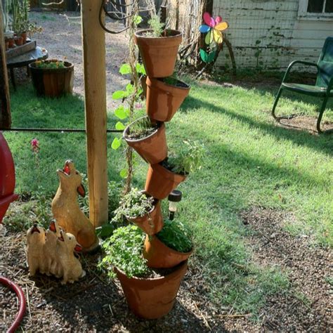 Stacked Clay Pots With Herbs Clay Pots Pot Outdoor Gardens