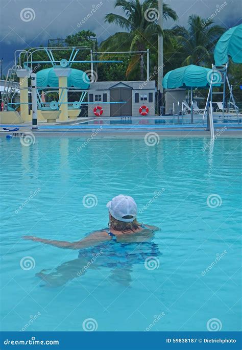 woman in outdoor public pool editorial photography image of pool stormy 59838187