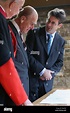 Prince Philip, Duke of Edinburgh (C) speaks with Ptolemy Dean (R), the ...