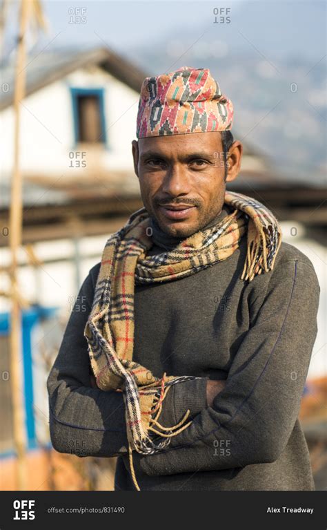 A Portrait Of A Nepali Man Wearing A Traditional Nepalese Hat Called A