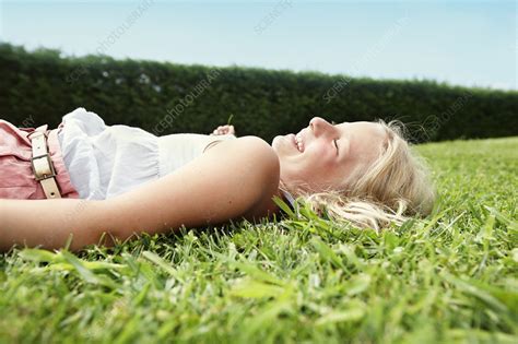 Smiling Girl Laying In Grass Stock Image F Science Photo Library