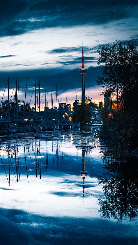 Download Wallpaper 2160x3840 Tower Boats Water Reflection Twilight