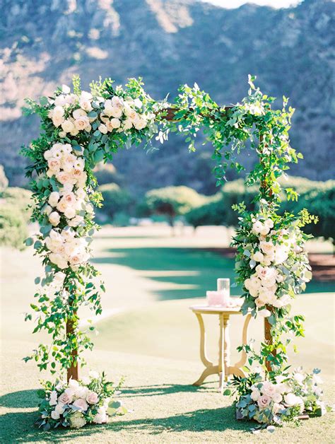 Square Wood Wedding Arch With Asymmetrical Flowers And Greenery At The
