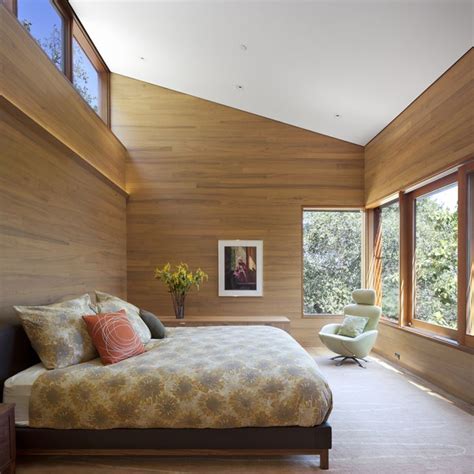 Wood Paneled Bedroom With High Clerestory Windows For Daylight And