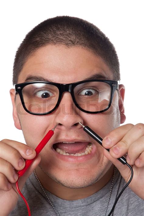 a goofy man wearing trendy nerd glasses isolated over white with a funny expression on his face