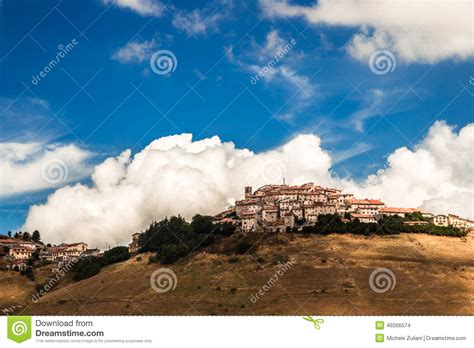 Grazing Lands And The Village Of Castelluccio Italy Stock Photo