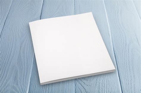 Premium Photo Blank Papers On Wooden Table