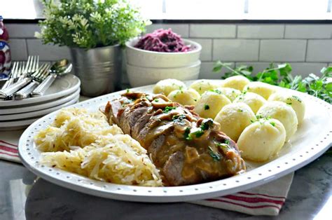 Polish Feast Roasted Pork Potato Dumplings Sauerkraut And Red