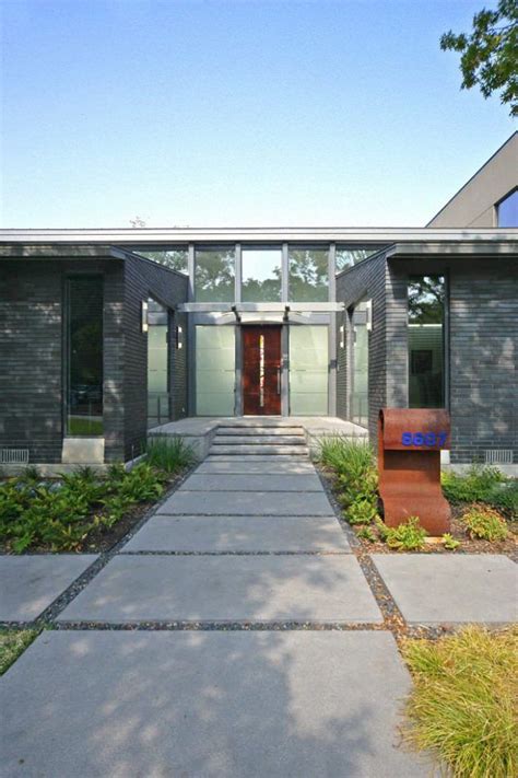 Contemporary Entry With Concrete Walkway Plus Art Glass And Flat Roof