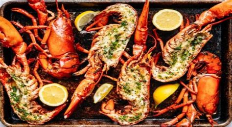 split grilled lobsters with herb butter on the xmas menu agonline