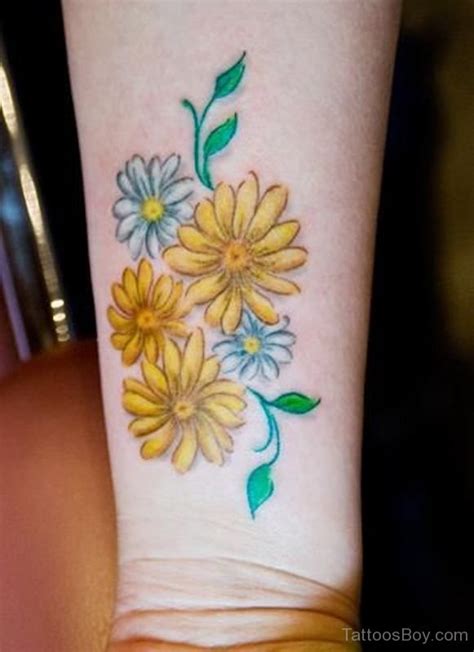 Yellow And White Daisy Flowers Tattoos On Forearm