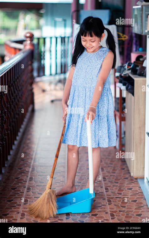 Girl Sweeping High Resolution Stock Photography And Images Alamy