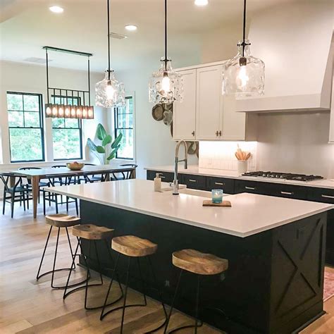 Bring a hint of industrial, contemporary design to your kitchen or entryway with this single pendant light. Modern farmhouse with two toned kitchen cabinets, matte ...