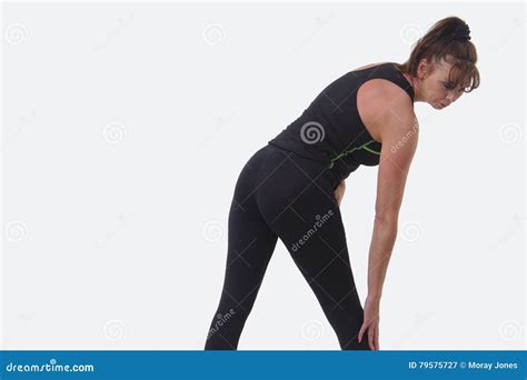 Attractive Middle Aged Woman In Sports Gear Stretching Stock Image