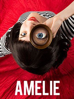 A Woman Holding A Magnifying Glass Up To Her Face With The Words Amelie On It