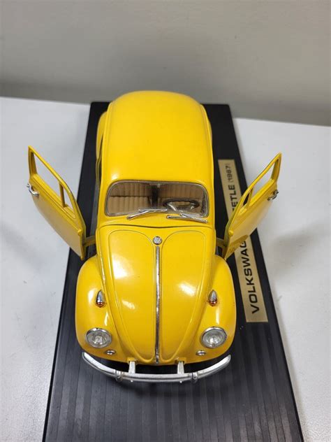 1967 Volkswagen Beetle Yellow Road Legends 118 Scale Die Cast On Stand