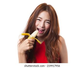 Beautiful Asian Woman Eating Banana On Stock Photo Edit Now 219917956