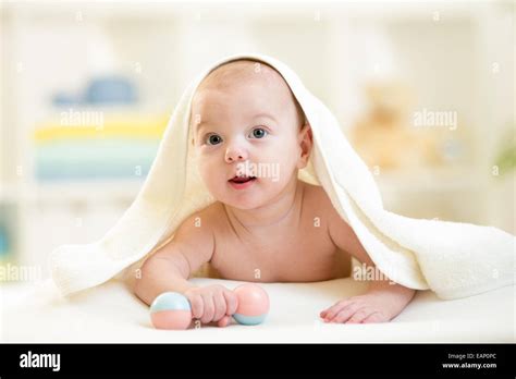 Cute Baby Under The Towel After Bathing At Home Stock Photo Alamy
