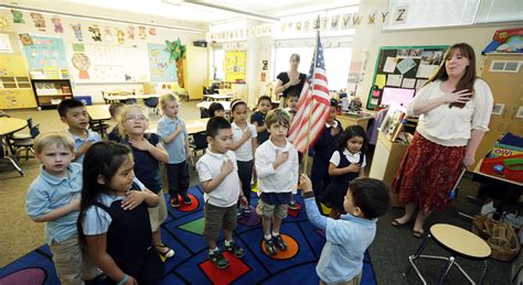 The original pledge of allegiance was written by francis bellamy. A Child Recites The Pledge Of Allegiance. A Mother ...
