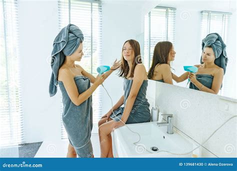 Mom Brushing Hair To Her Daughter In Hotel Bathroom Stock Photo Image