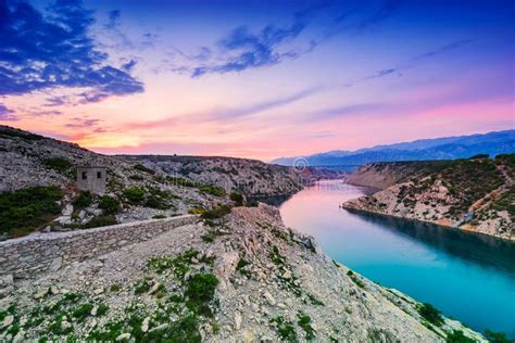 Colorful Dramatic Sunset Over The River And Mountains In Dalmatia