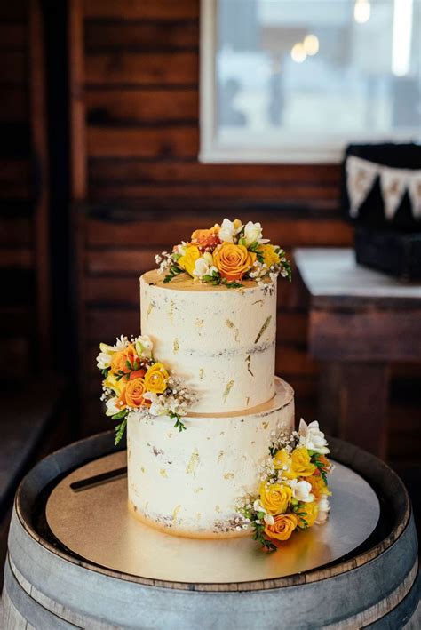 Vibrant And Colourful Winery Wedding Yellow Wedding Cake Flower Cake