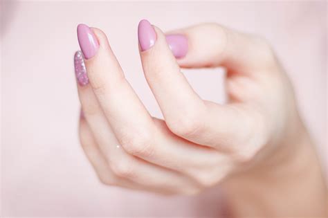 Persons Hand With Pink Manicure · Free Stock Photo