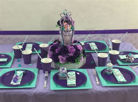 Welcome guests into the baby shower with green, pink, purple, and yellow banners, fluffy decorations, swirl decorations, streamers, and more. Pacifier Centerpiece - Purple Lavender and Aqua / Girls ...