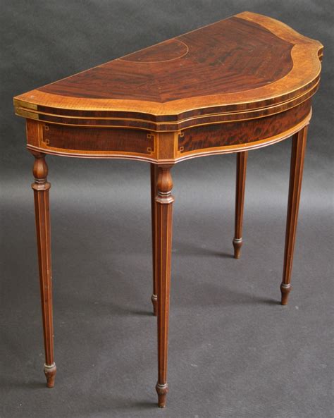 During the victorian era, oval or round types of card tables emerged known as the loo table. Edwardian Inlaid Shaped Half Round Card Table. | 291829 | Sellingantiques.co.uk