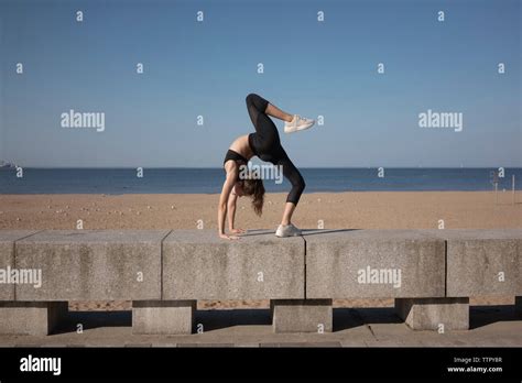 Young Woman Bending Over Backwards High Resolution Stock Photography