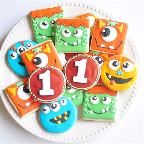 Decorated Cookies With The Number One On Them Are Arranged In An Order