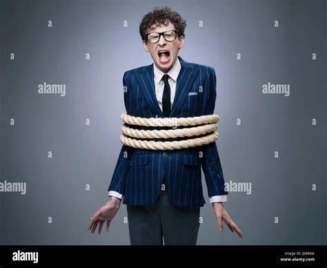 Funny Business Man Tied Up With Rope Screaming For Help Stock Photo Alamy