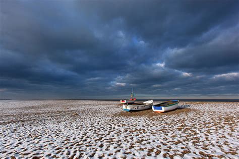 Cley Beach With Light Snow And Boats Norfolk England Uk Photograph