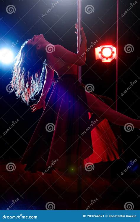 Slender Woman Dancing On A Pole On A Red Background Pole Dance Stock