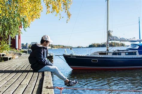 Person Sitting On Dock · Free Stock Photo