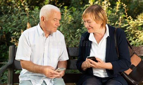 Senior Couple Using Smartphones Stock Image Image Of Mature Bench 218253325